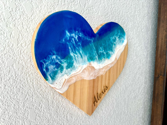 Wood heart wall decor decorated with resin ocean waves in brilliant blue and turquoise with foaming white.