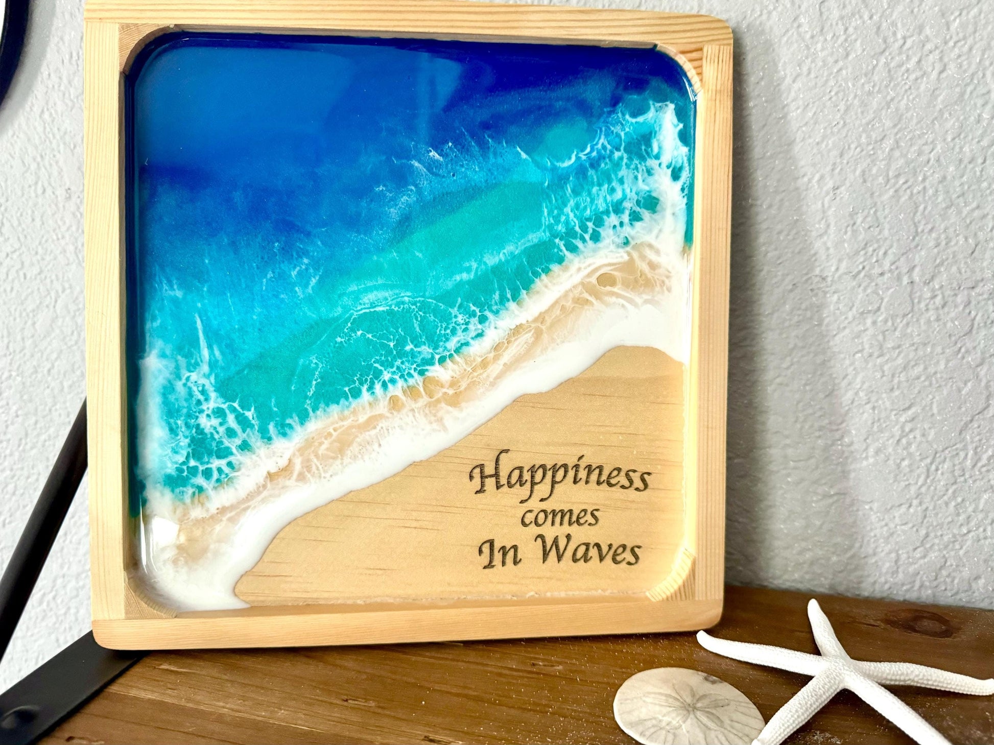 Wooden plaque with resin ocean waves and engraved sentiment "Happiness comes In Waves"