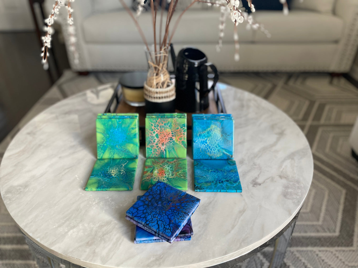 Hand painted 4 inch square coaster sets in various colors of green and blue. 