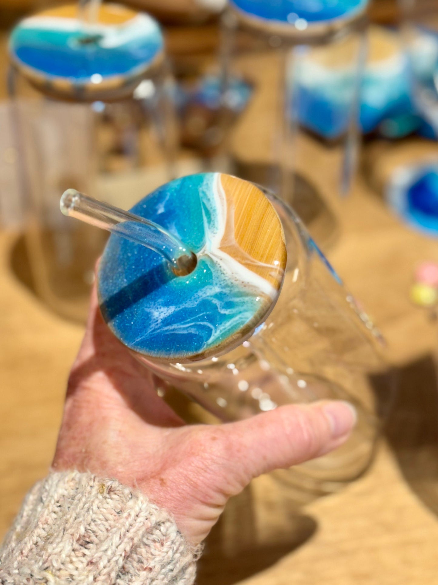 Resin Ocean Wave Drinking Glass with Bamboo Lid and Glass Straw for The Ocean Lover who wants that Coastal Vibe in home decor or bar ware.