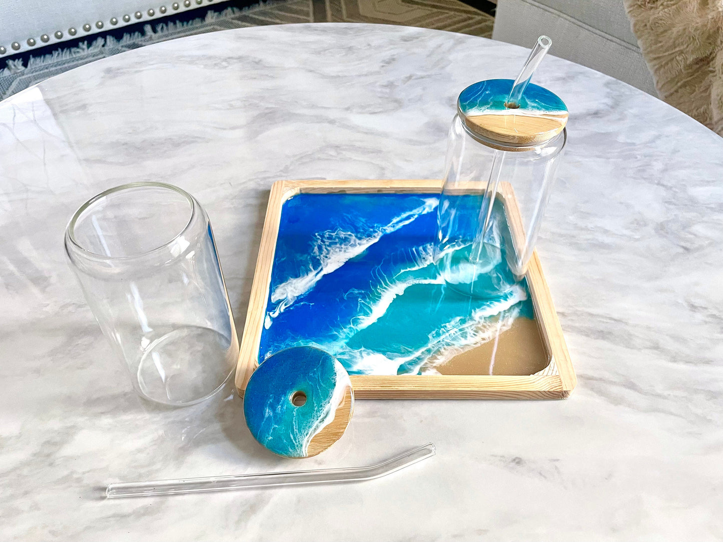 Resin Ocean Wave Drinking Glass with Bamboo Lid and Glass Straw for The Ocean Lover who wants that Coastal Vibe in home decor or bar ware.