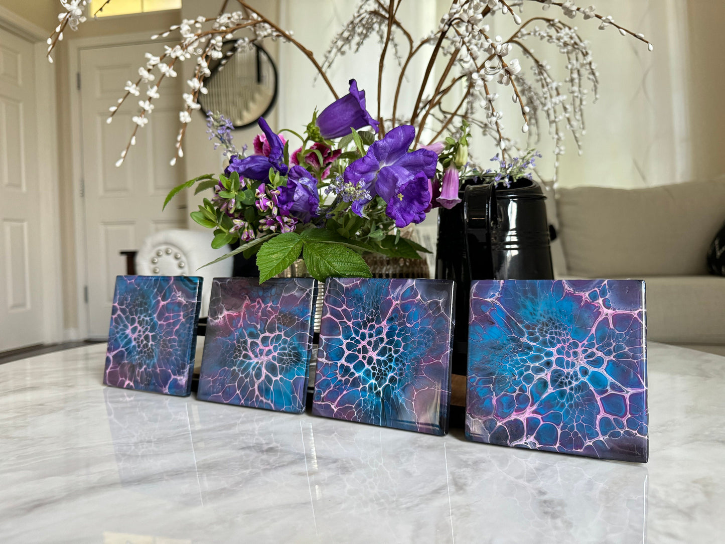 Decorative Handmade Ceramic Coasters in Blue and Purple. Paint Pour Drink Coasters are a great Housewarming Gift for any Home Decor.