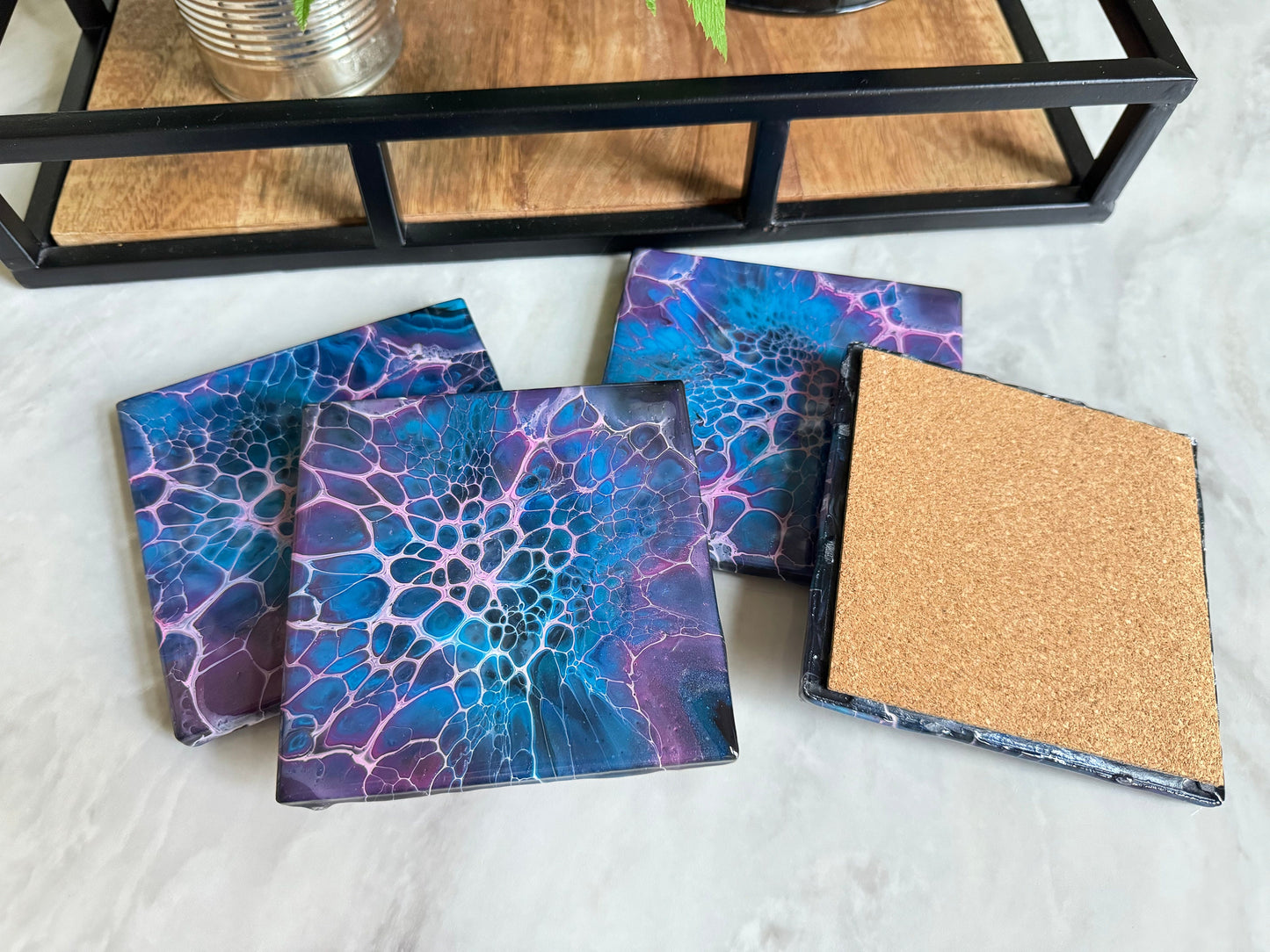 Decorative Handmade Ceramic Coasters in Blue and Purple. Paint Pour Drink Coasters are a great Housewarming Gift for any Home Decor.